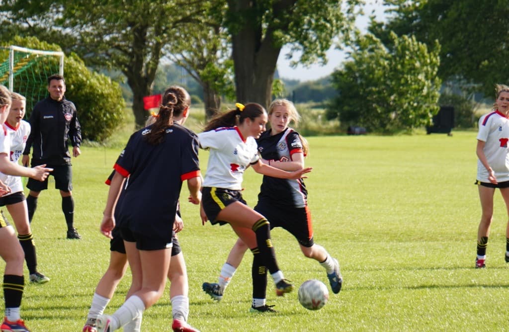 United Football Sporting Girls team walking out at ACES Nationals 2026