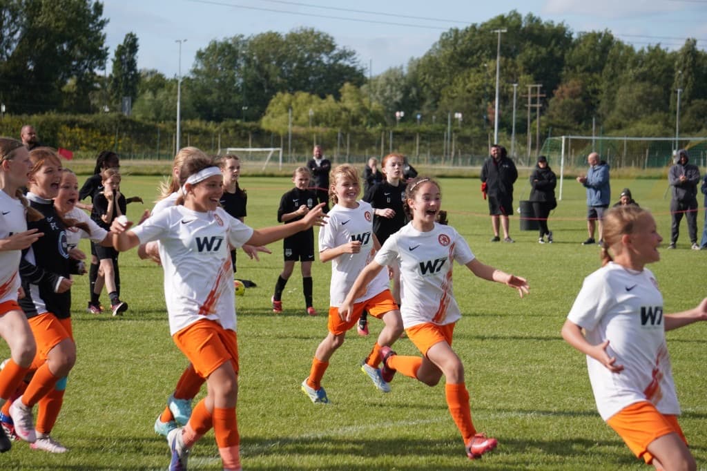 Young player striking the ball at ACES Nationals 2026